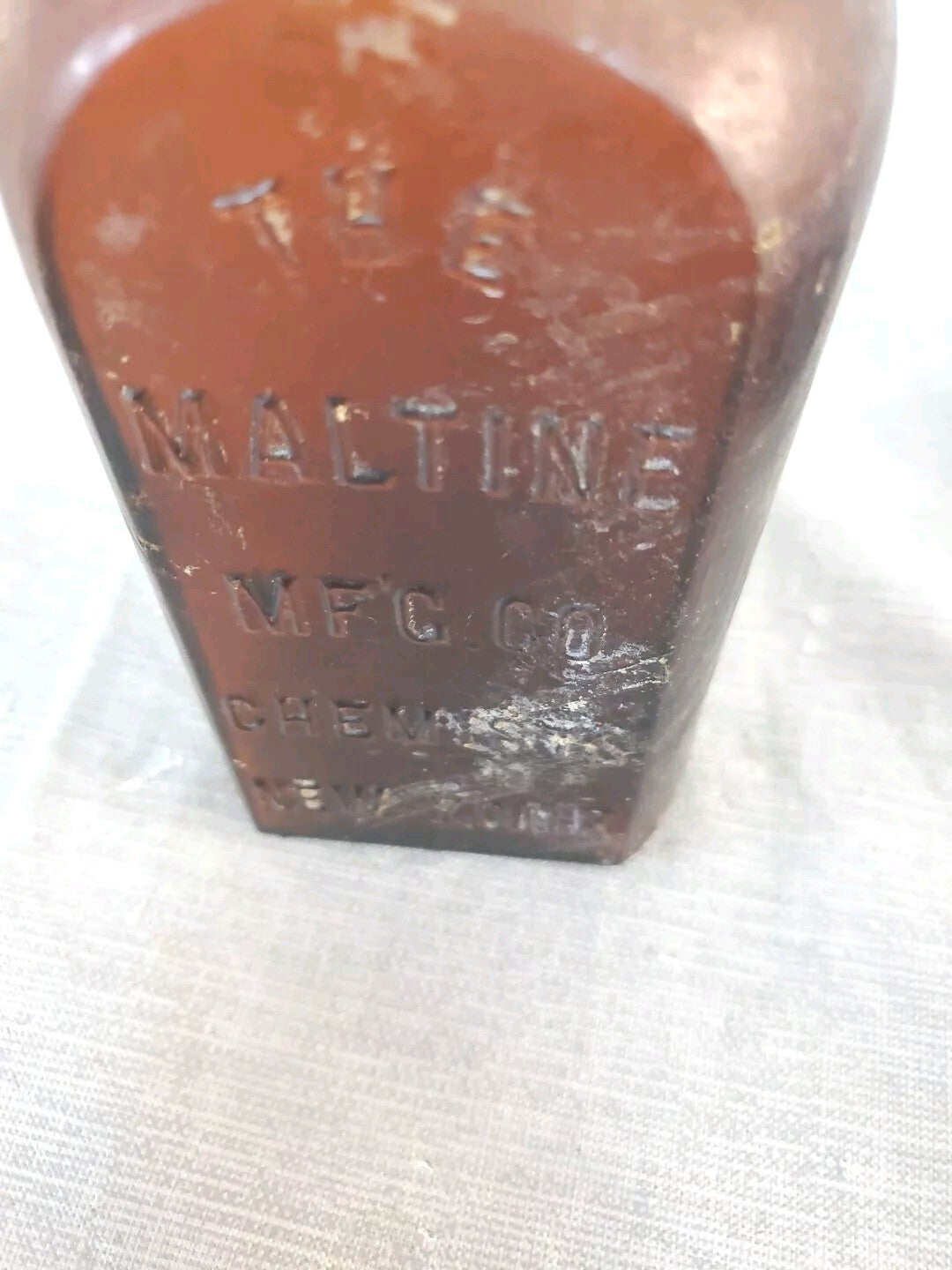 Antique medicine bottle THE MALTINE  MF'G. CO. CHEMISTS  NEW YORK amber color