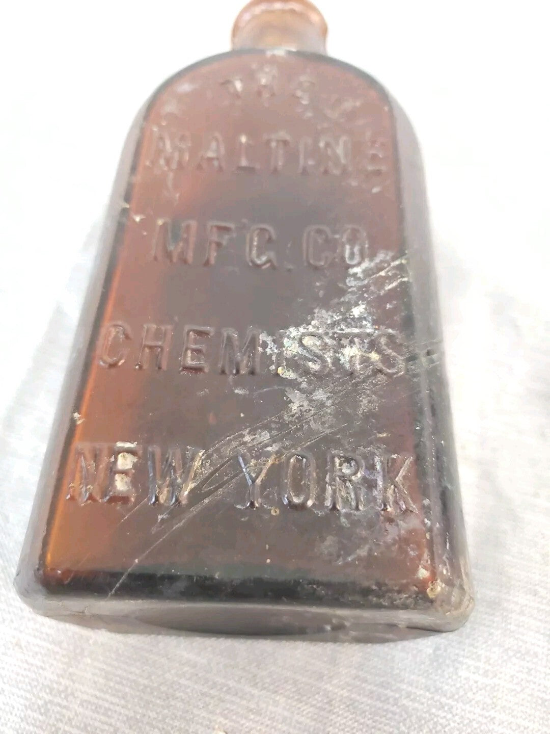 Antique medicine bottle THE MALTINE  MF'G. CO. CHEMISTS  NEW YORK amber color