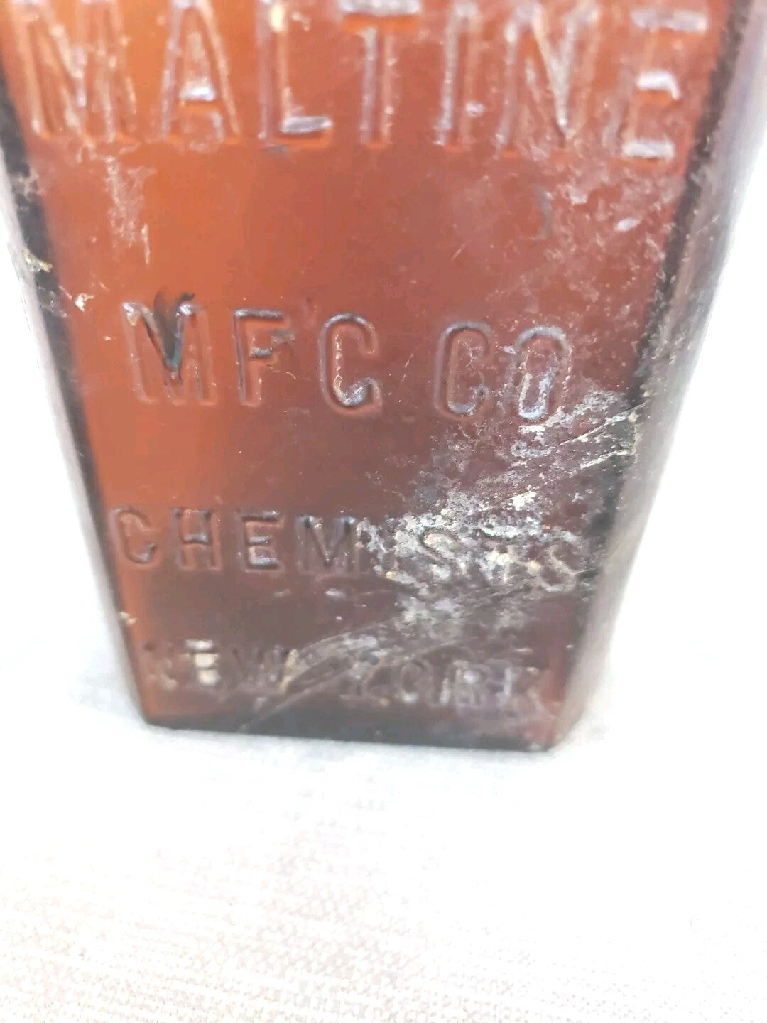 Antique medicine bottle THE MALTINE  MF'G. CO. CHEMISTS  NEW YORK amber color